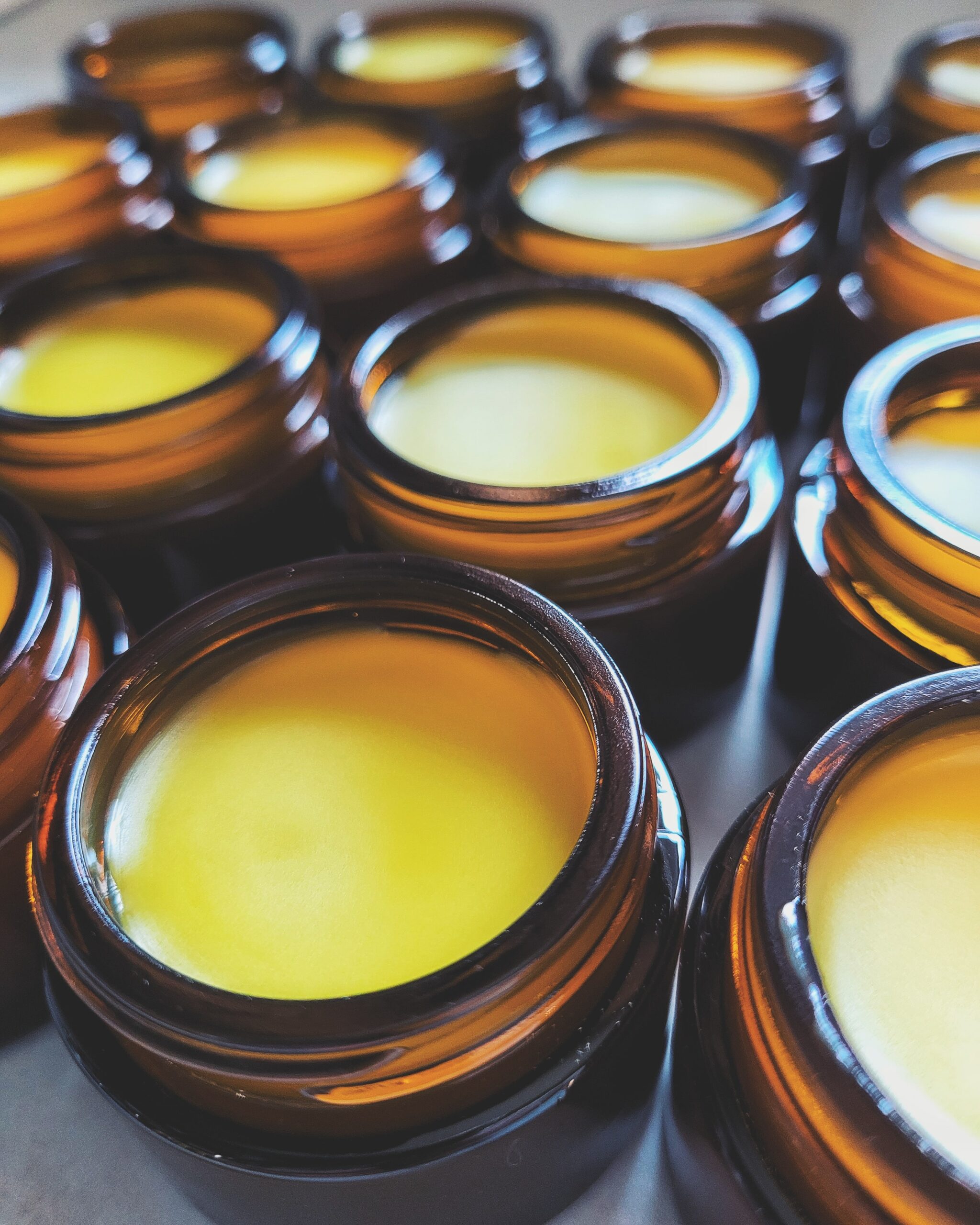 dandelion calendula salve in amber jars ion counter top