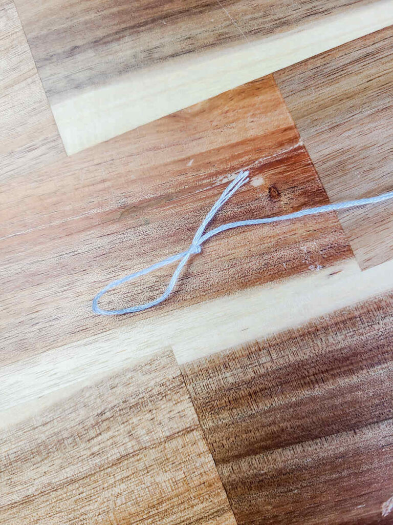 close up photo of sting tied with a knot at the end