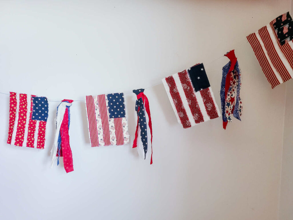 bunting flag banner hanging on white wall 