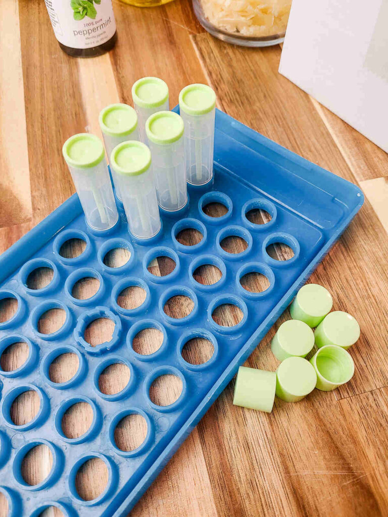 lip balm tubes fitted into filler kit before filling. 