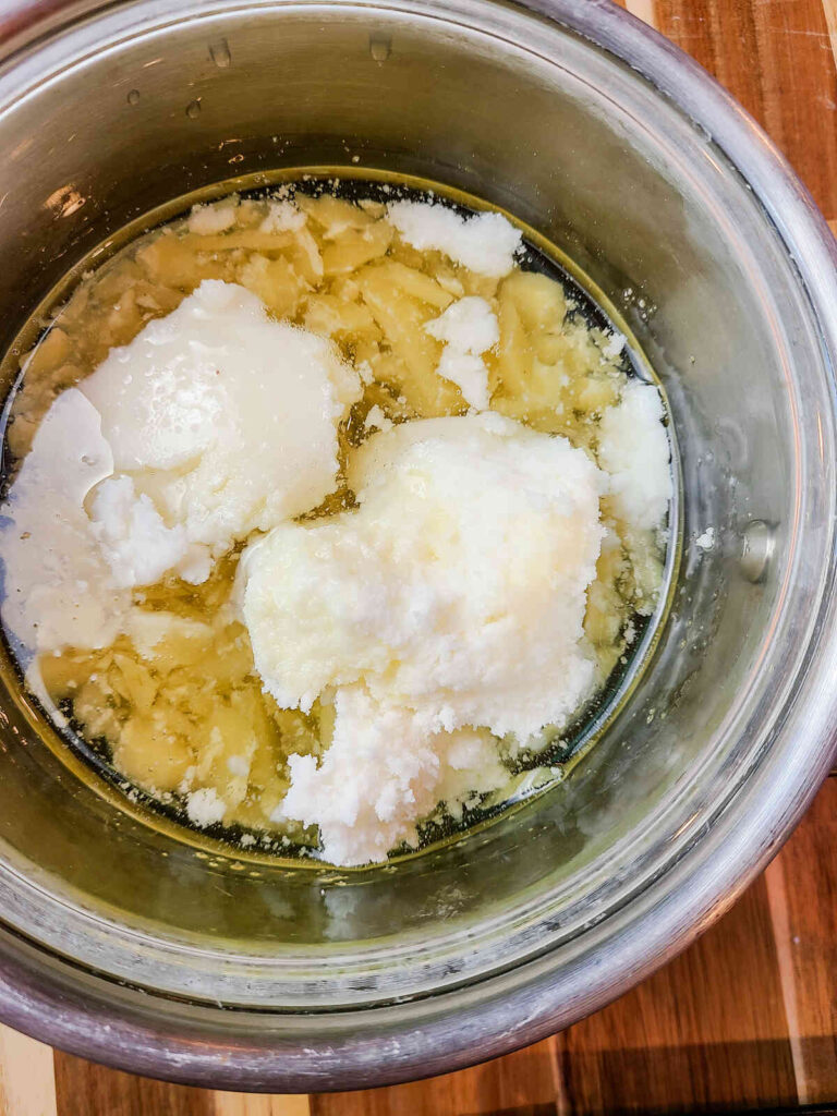 pot full of lip balm ingredients on heat to melt.