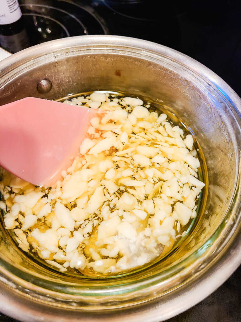 pot full of lip balm ingredients on heat to melt. 
