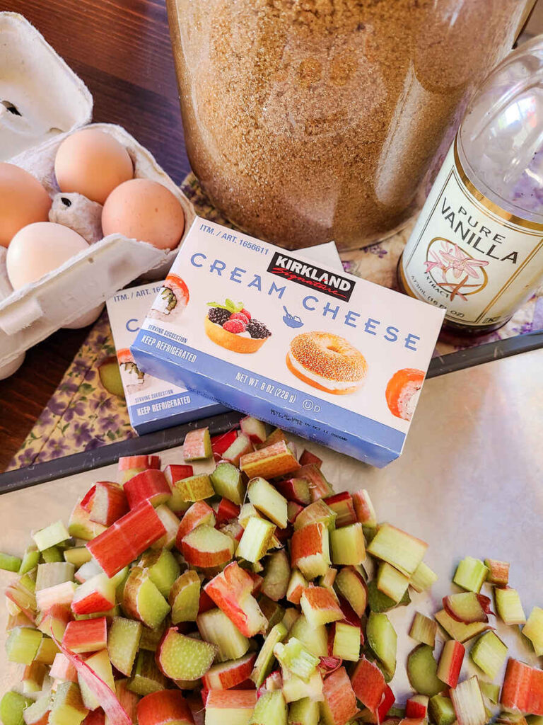 ingredients for the cream cheese filling eggs, brown sugar, cream cheese, vanilla, and rhubarb 