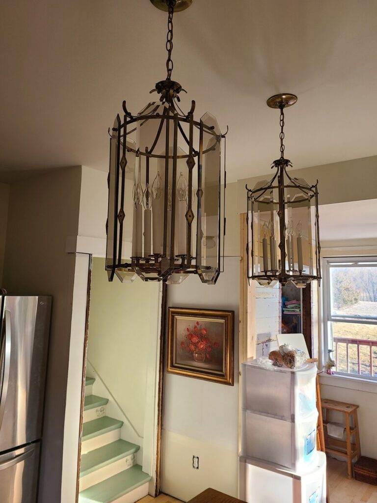 kitchen with large glass paned island lights 