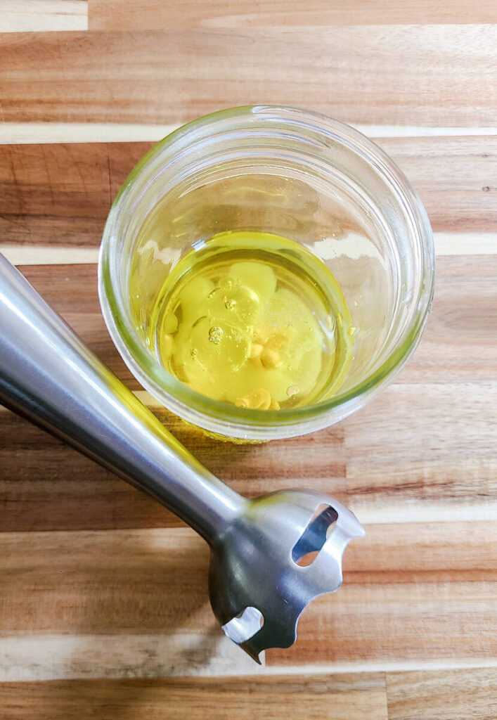 woman blending mayo using immersion blender 