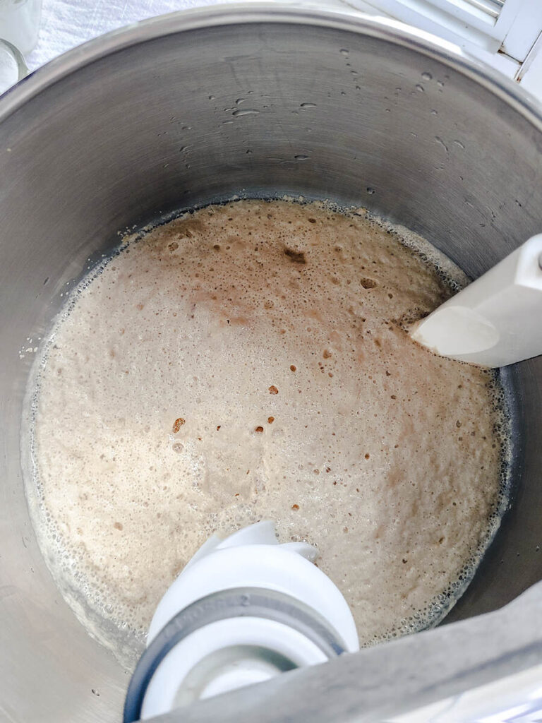 bubbly activated yeast mixture in standing mixer bowl 