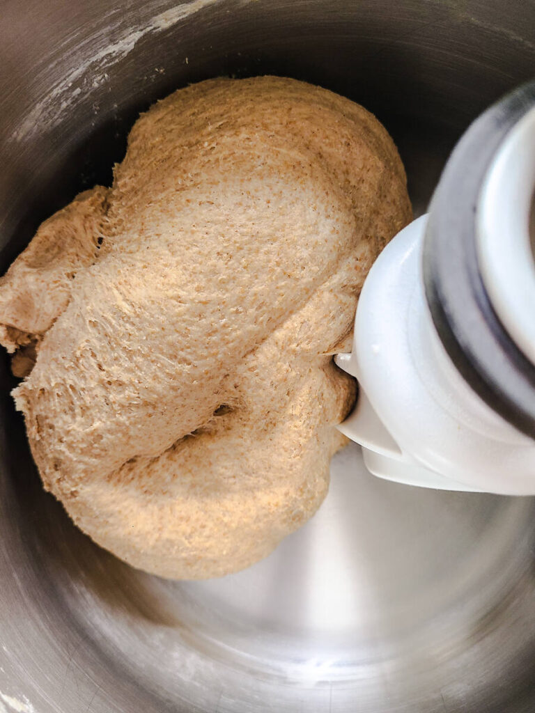 smooth dough ball formed in standing mixer bowl 